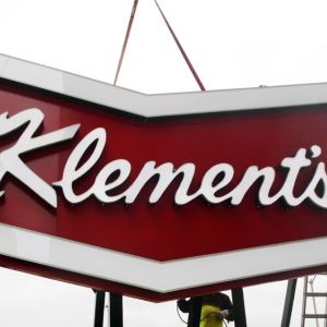 Installation of Klement's Sausage Cabinet Sign